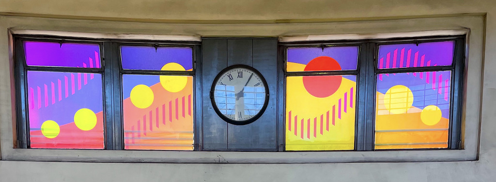 Sun blazing through window art over escalators at Southgate Station © Dan Maier